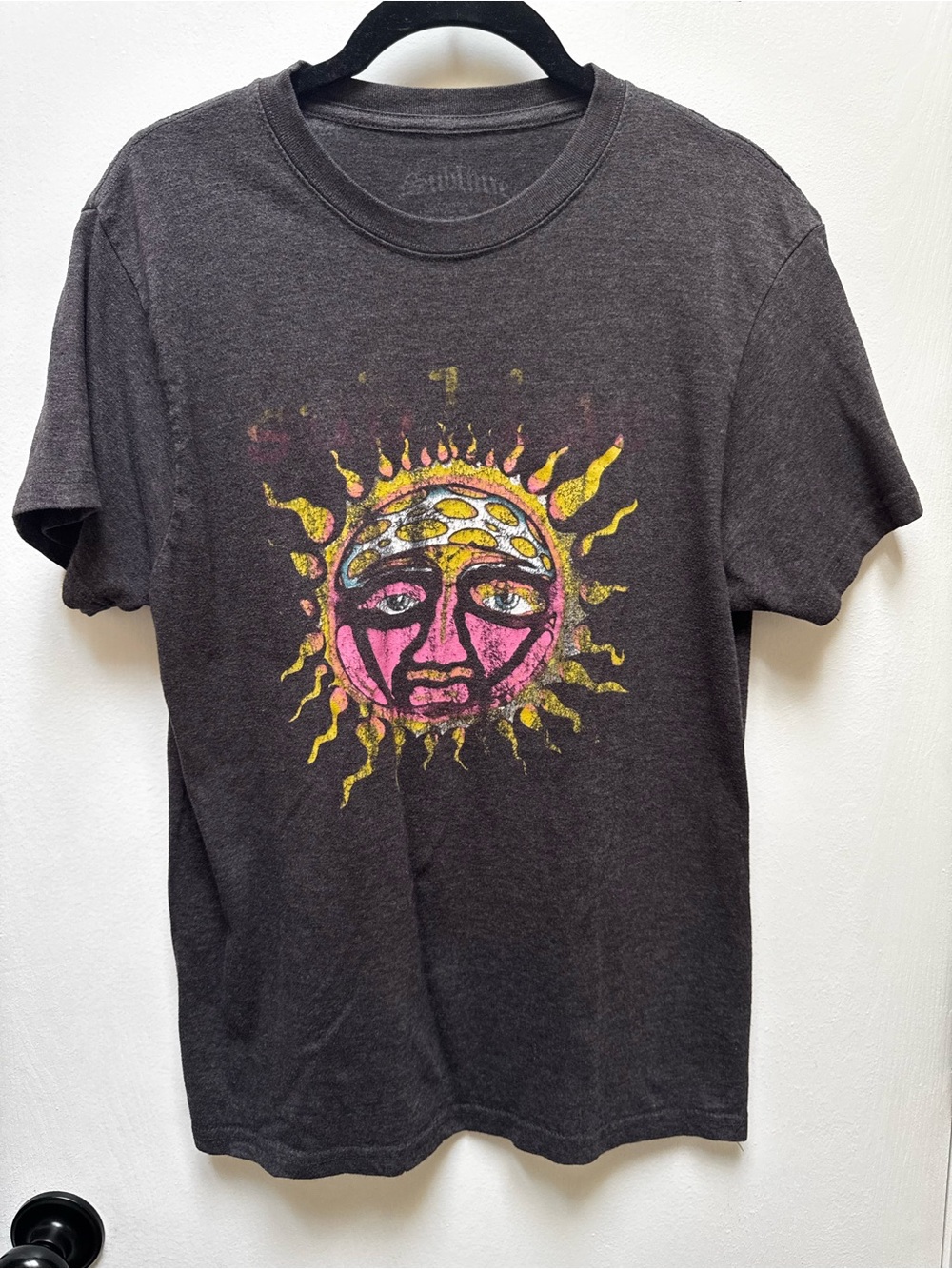 Vintage-Inspired Black Graphic Sun Tee with Pink & Yellow Artwork